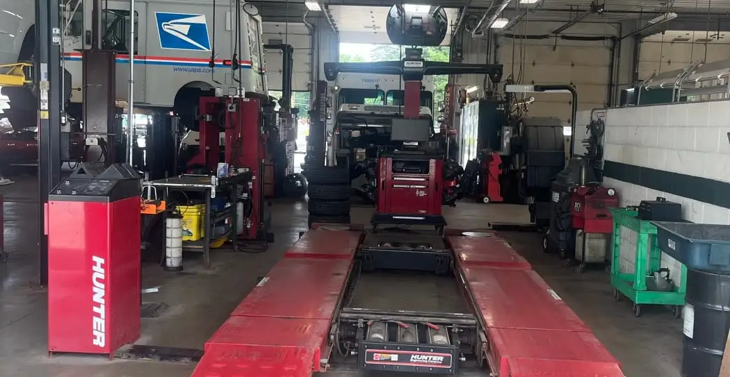A United States Postal Service vehicle on the alignment rack at Fogg's Automotive
