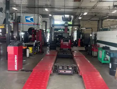Hunter alignment rack and a United States Postal Service vehicle in for fleet service at Fogg's Automotive