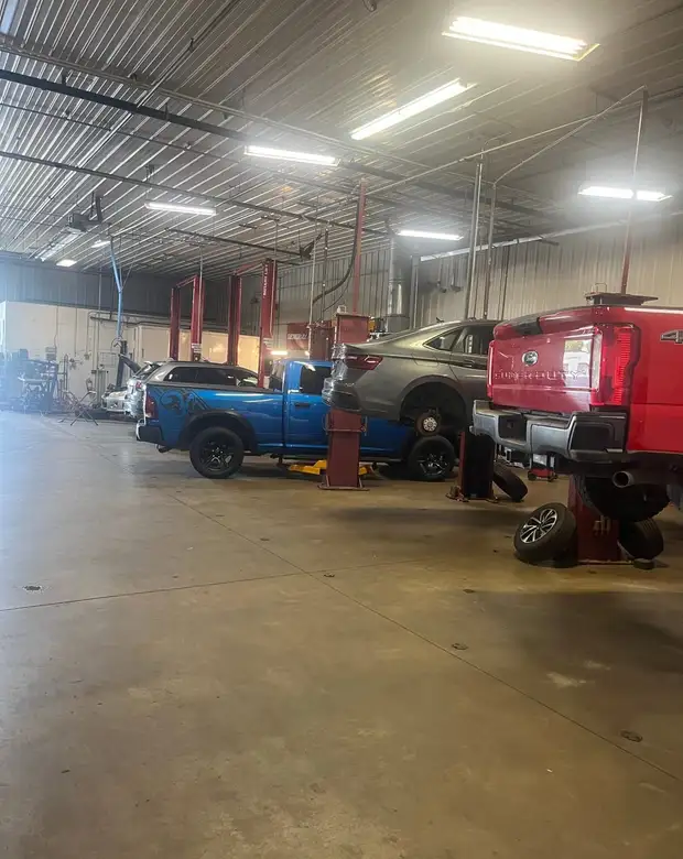 Vehicles on the lifts inside the Fogg's Automotive service center in Scotia, NY