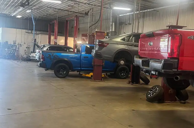 Vehicles on the lifts inside the Fogg's Automotive service center in Scotia, NY